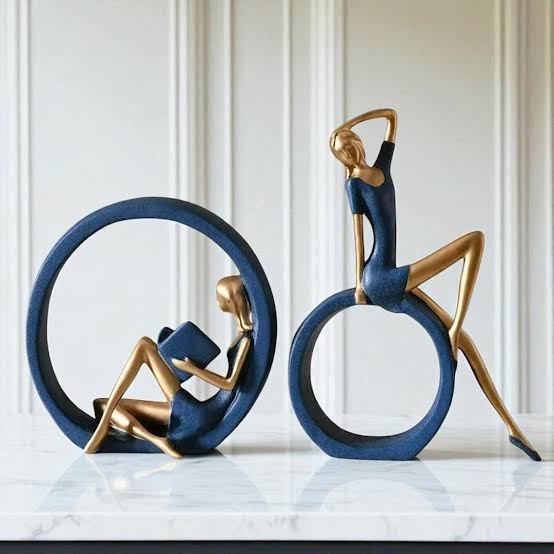Figure Reading and Yoga Girl Sculpture.